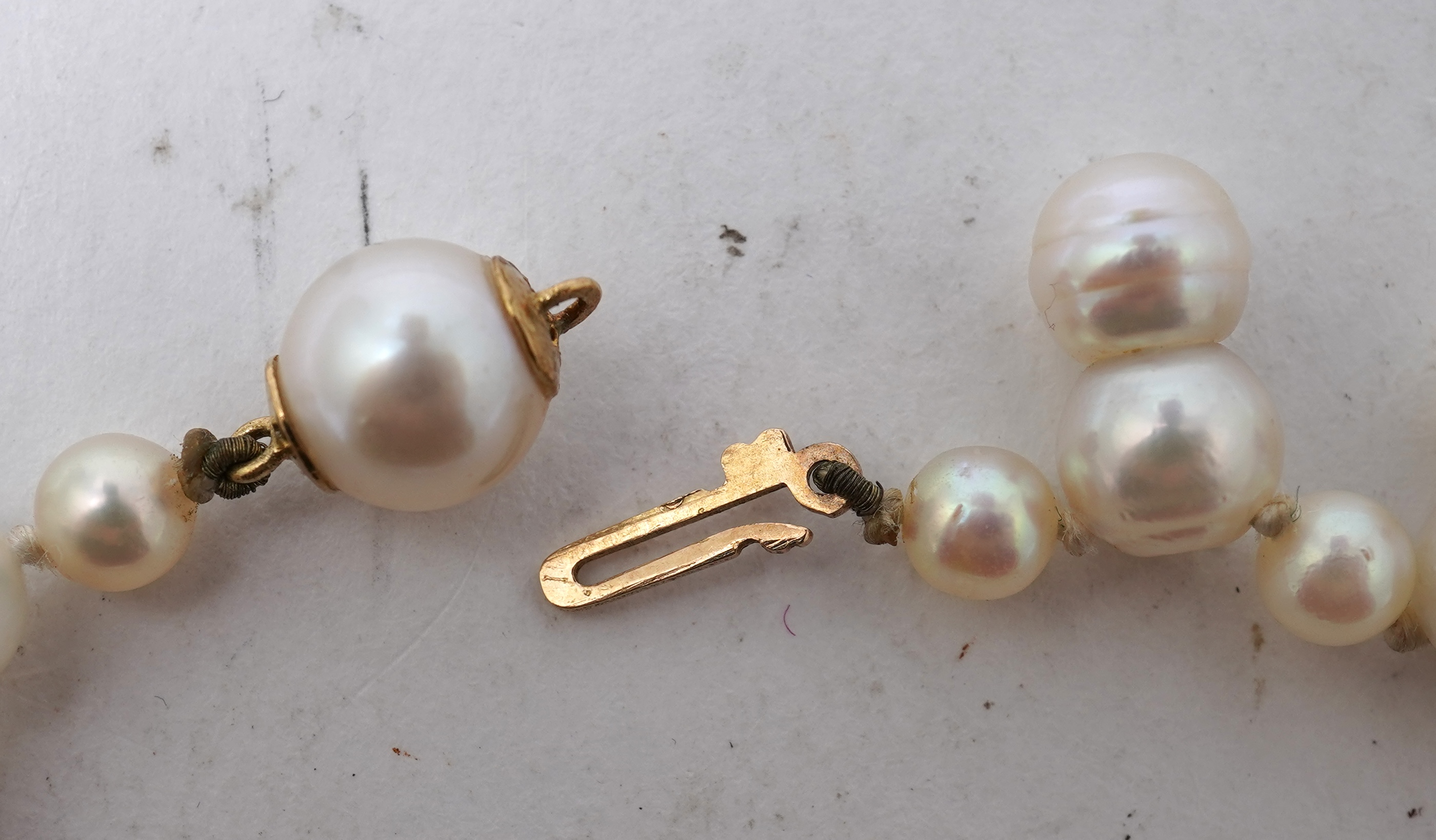 A collection of four cultured pearl necklaces